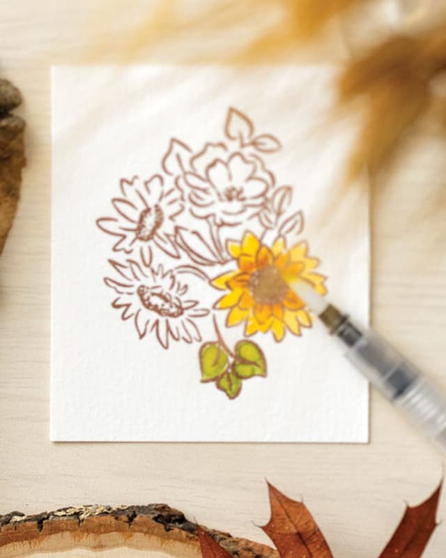Watercolouring a stamped sunflower bouquet with a water brush