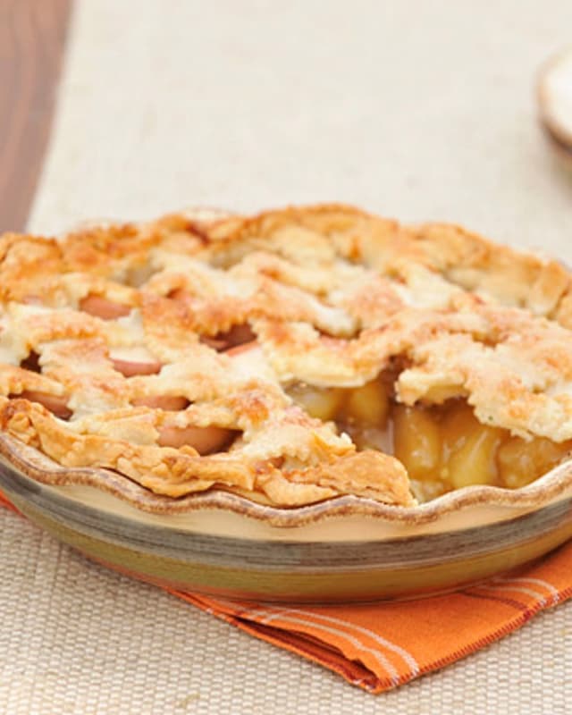 Fluted pie plate with apple pie