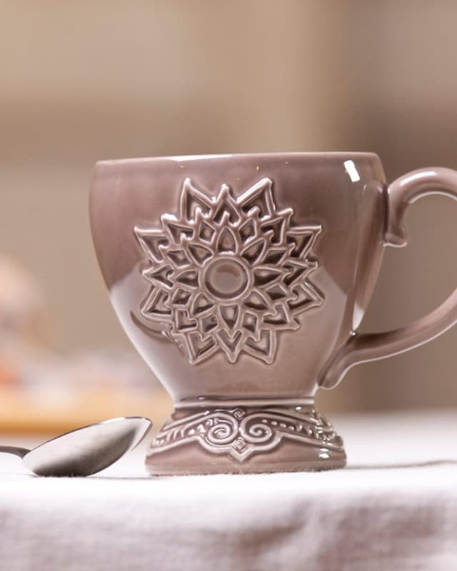 Embossed footed mug