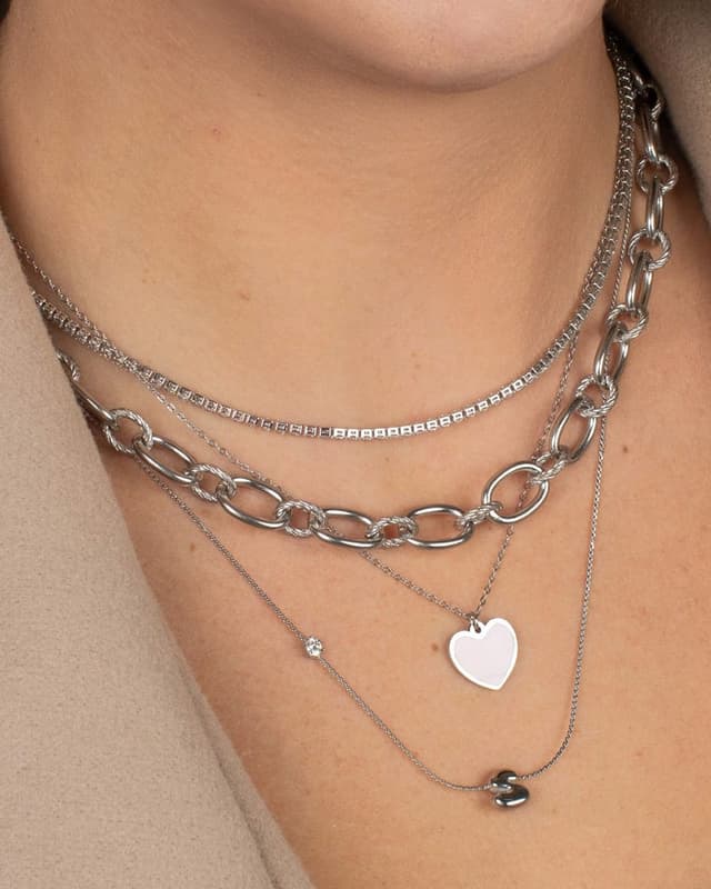 Layered silver chains with heart pendant