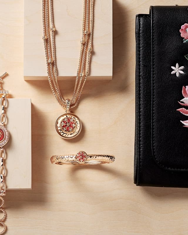 Rose gold-tone snap necklace, bracelet and floral handbag