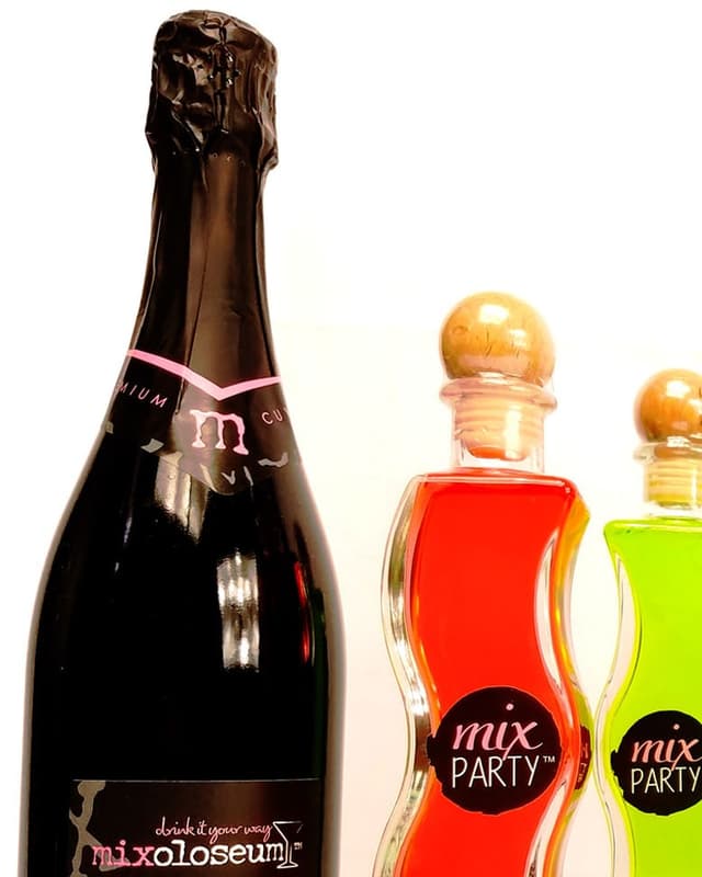 Bubbles red sparkling wine with wine cocktails in wavy bottles