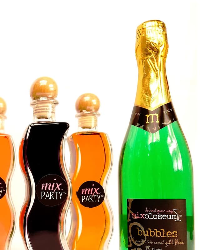 Wine cocktails beside Bubbles sparkling wine with 24-carat gold flakes