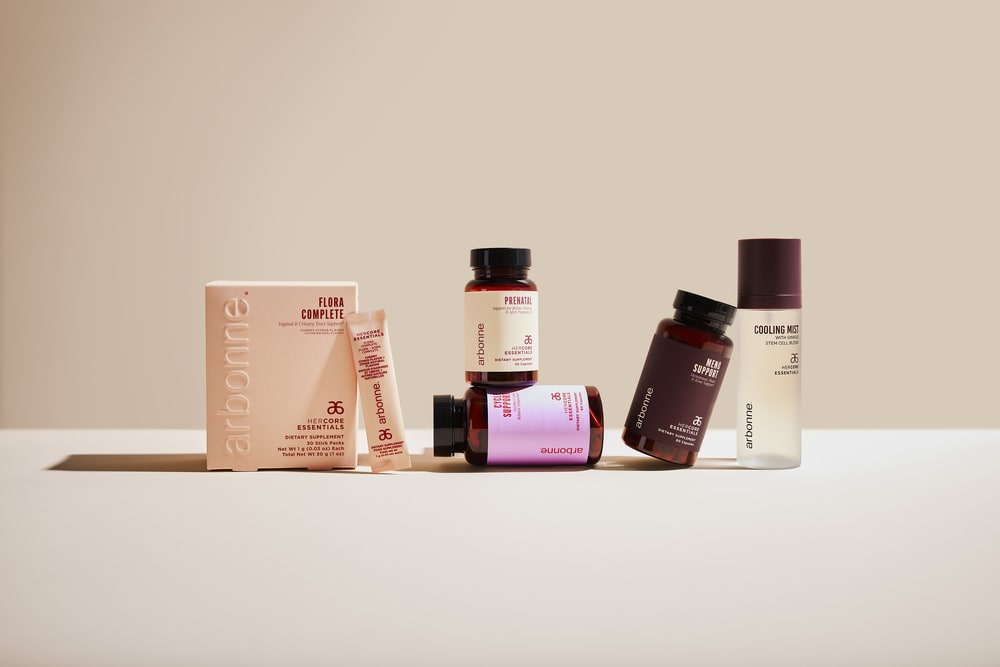 Arbonne HerCore Essentials supplements including Flora Complete, Prenatal and Meno Support, with a Cooling Mist