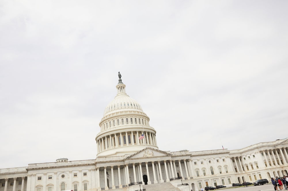 The dome of the US Capitol in Washington, DC under a pale overcast sky