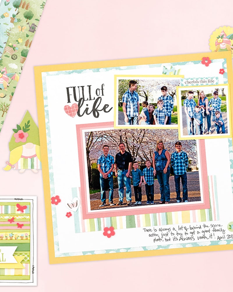 Spring family scrapbook page with gnome-themed papers and a card