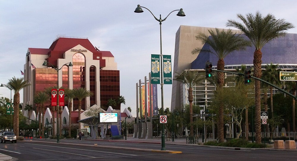 Palm trees and office buildings in downtown Mesa, Arizona, at dusk