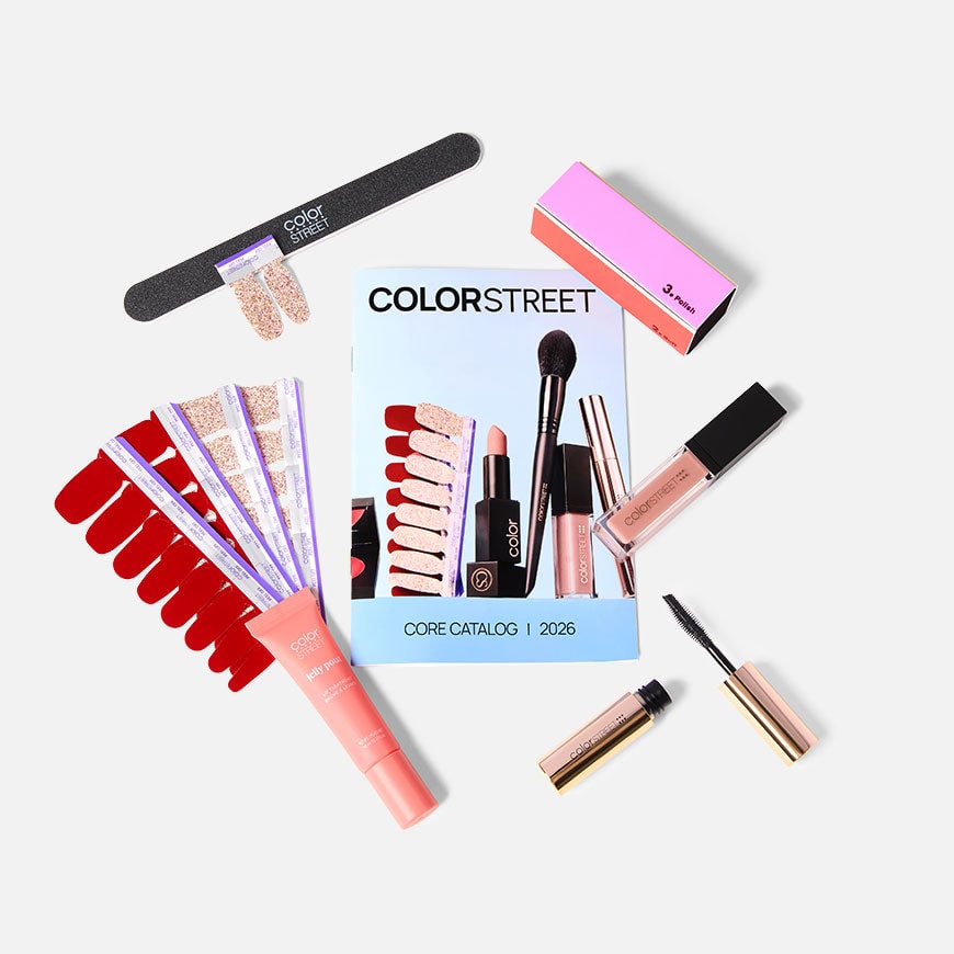 Color Street Starter Kit laid out: red and glitter nail strips, nail file, buffer block, lip oil, lip treatment, mini mascara and the 2026 core catalog