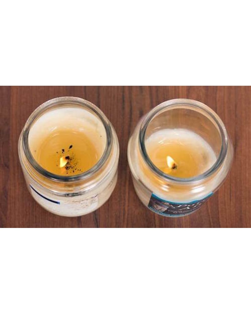 Burn test: a paraffin candle beside a David Oreck soy blend candle