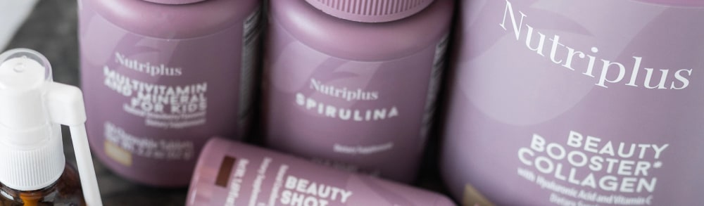 Nutriplus by Farmasi supplement bottles including Multivitamin for Kids, Spirulina and Beauty Booster Collagen