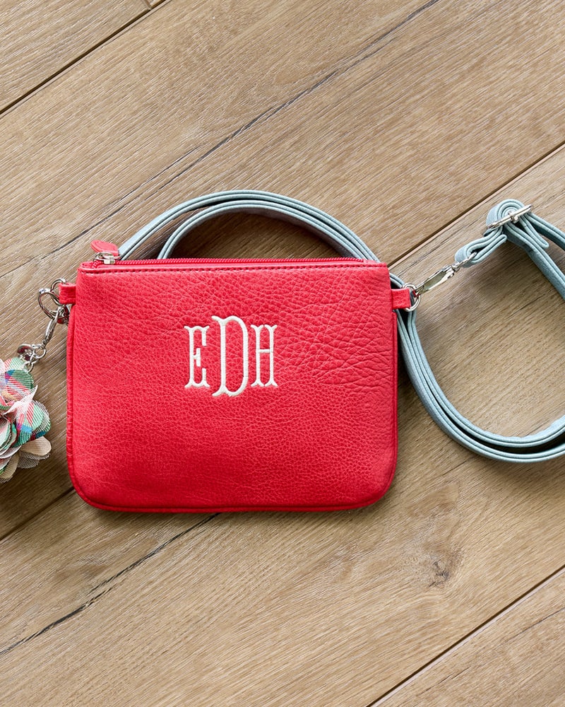 Red monogrammed crossbody clutch