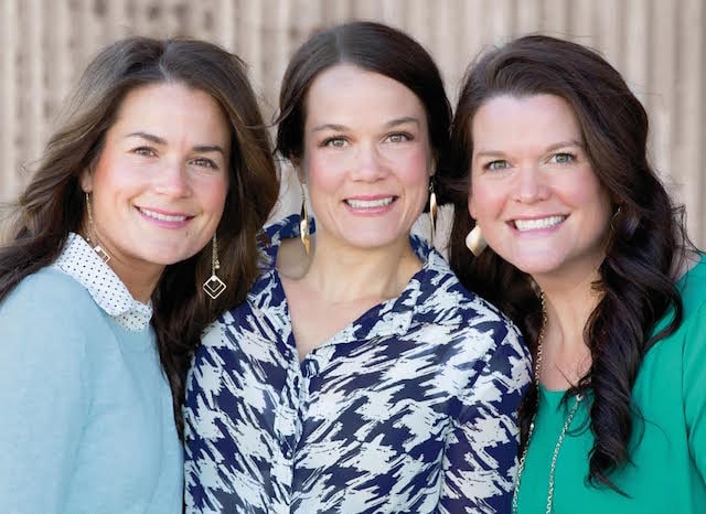 Jamberry founders Lyndsey, Christy and Keri, three smiling sisters, standing side by side