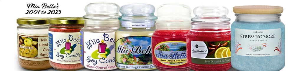 A row of Mia Bella's jar candles showing how the packaging changed from the early soy candles to the current wood-lidded palm wax jars