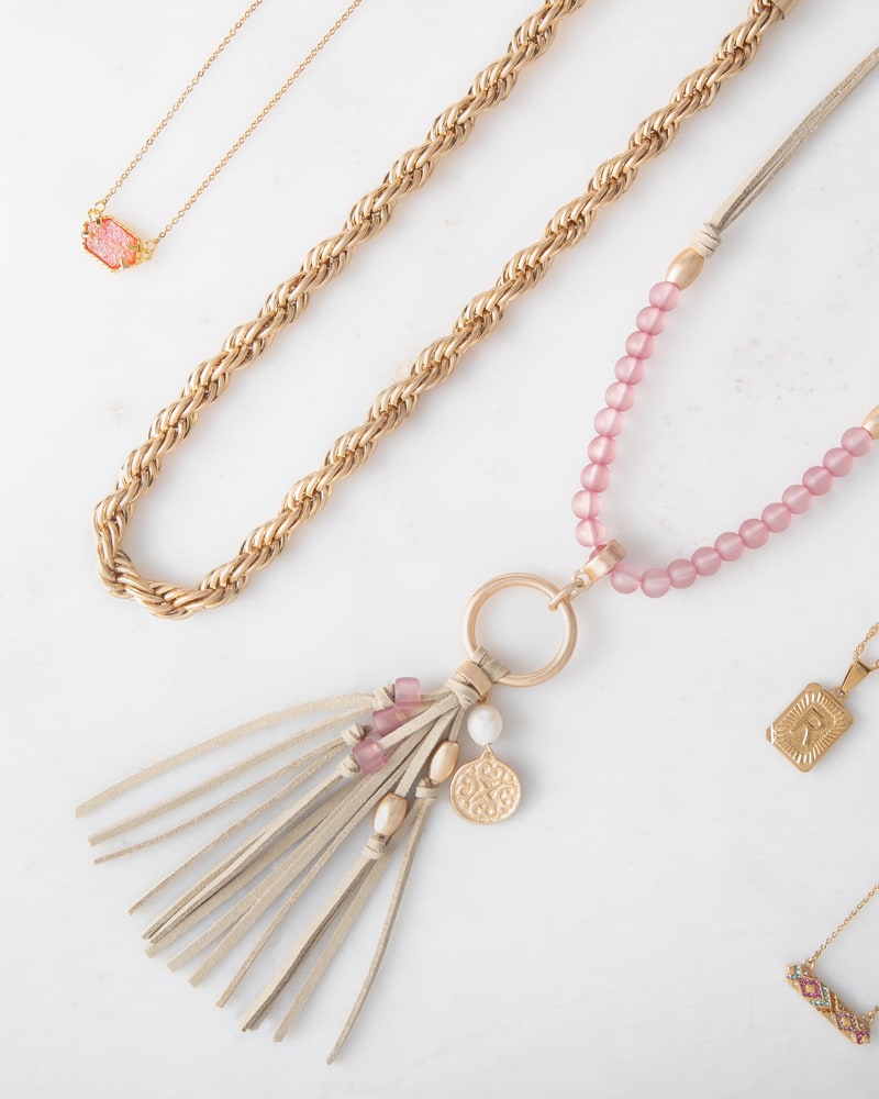 Layered necklaces with a tassel pendant