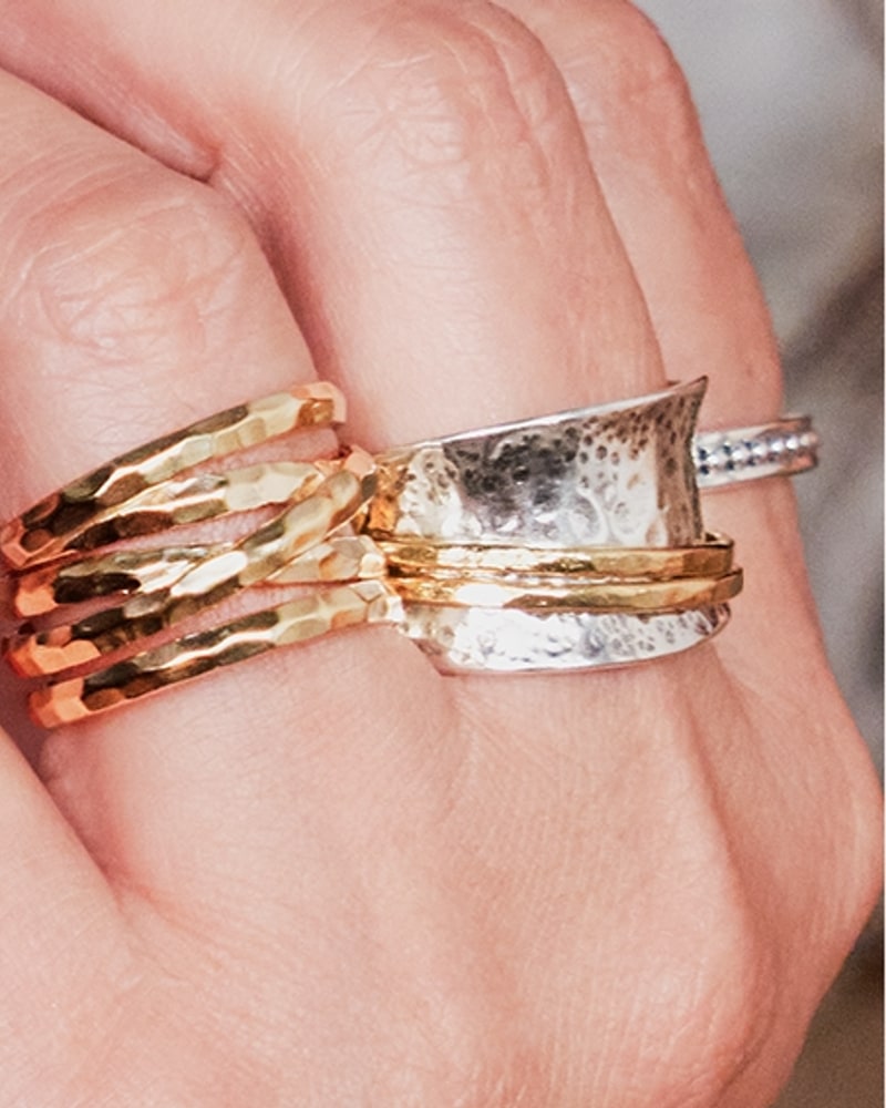 Hammered silver and gold-tone spinner ring