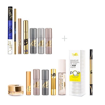 The Tyra Beauty Beyond Basic starter kit laid out: makeup sticks, mascara, liners, lip gloss and makeup remover wipes