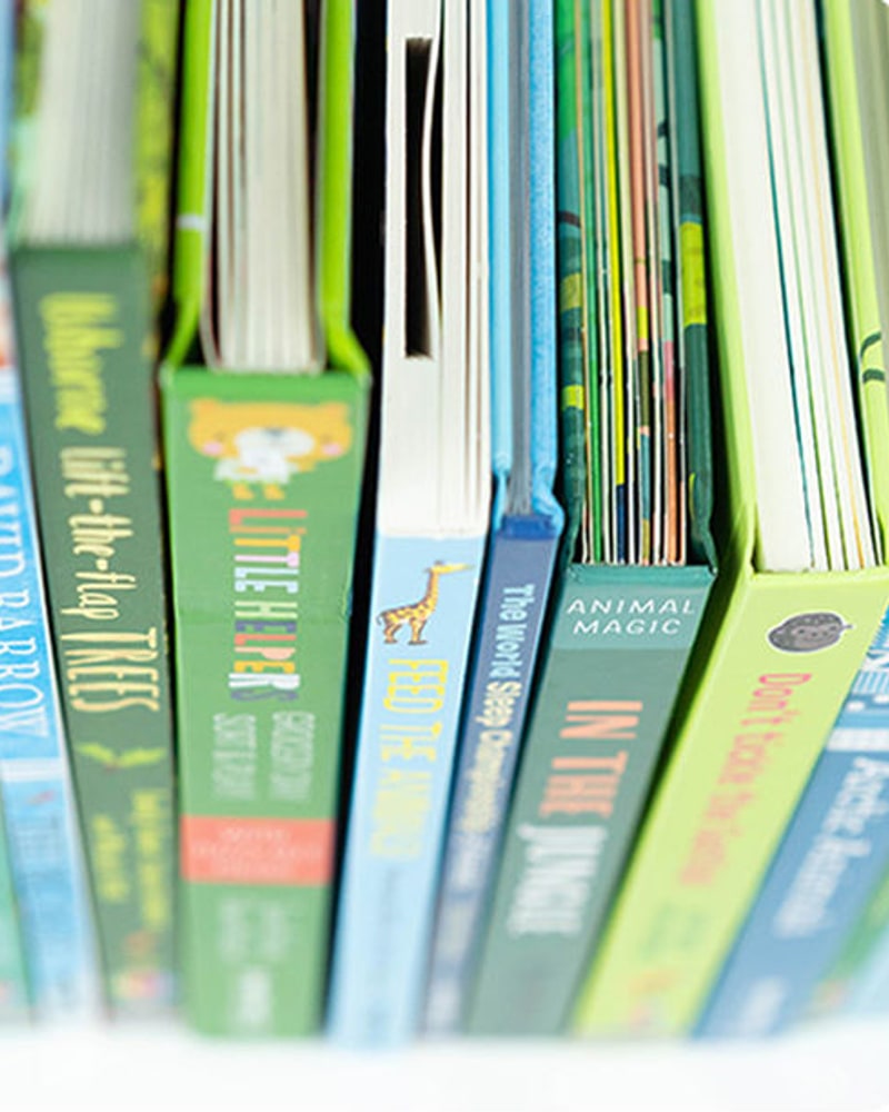 Usborne and Kane Miller board books on a shelf