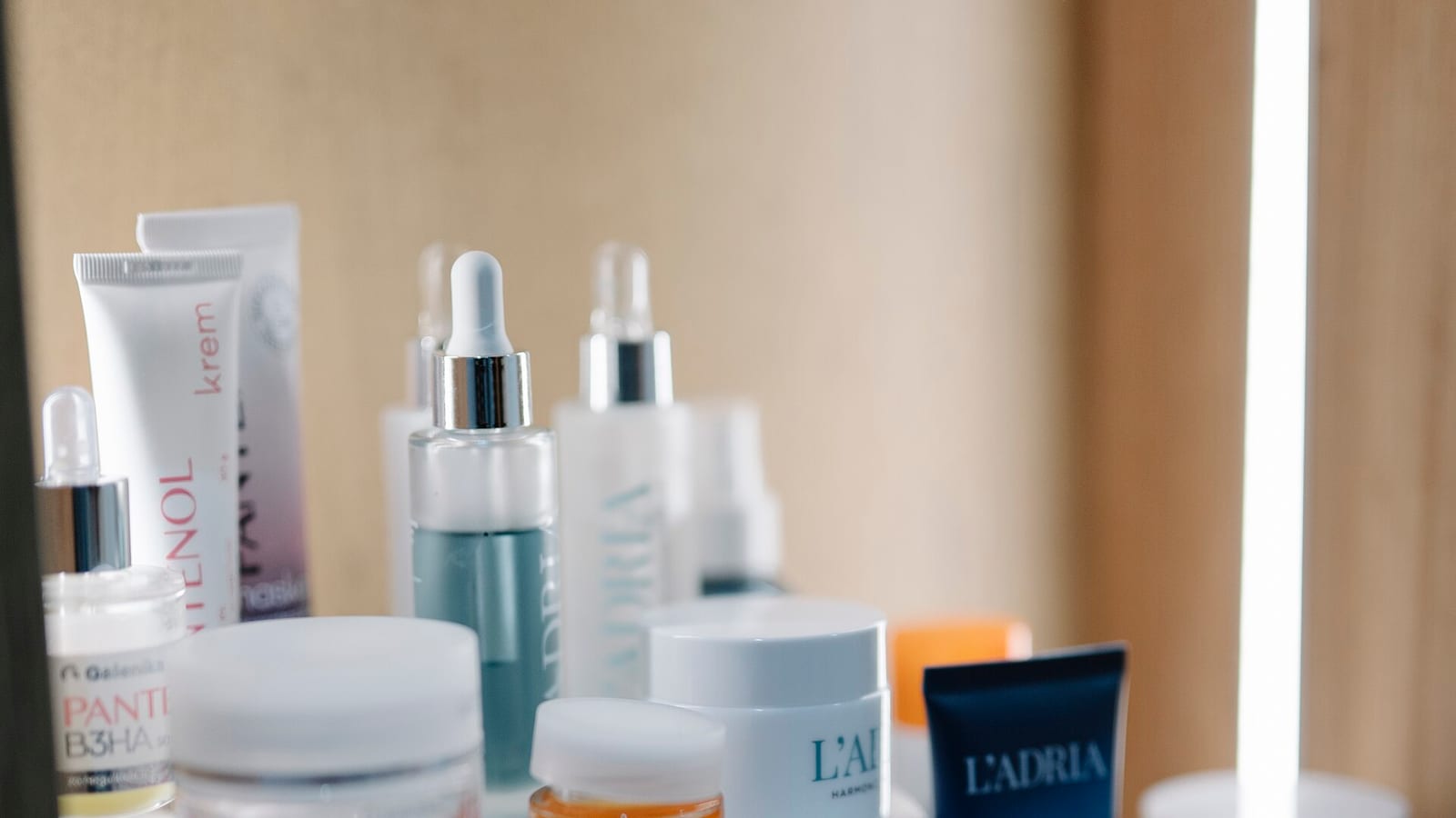 A shopper picks a skin care product from a store display